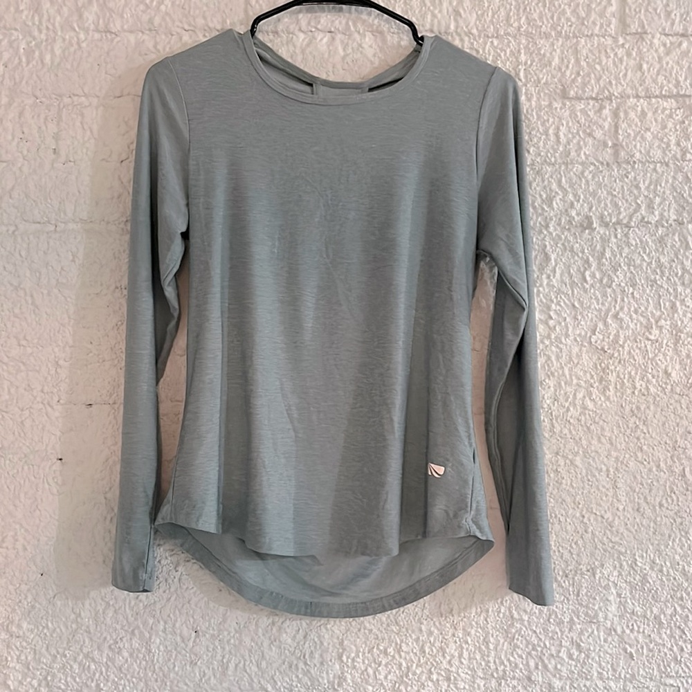 Marika Athletic long sleeve top with back cut out. Size small